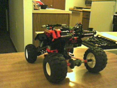 red_four_wheeler__atv_with_large_tires_2.jpg