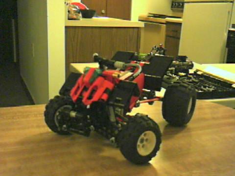 red_four_wheeler__atv_with_larger_wheels.jpg