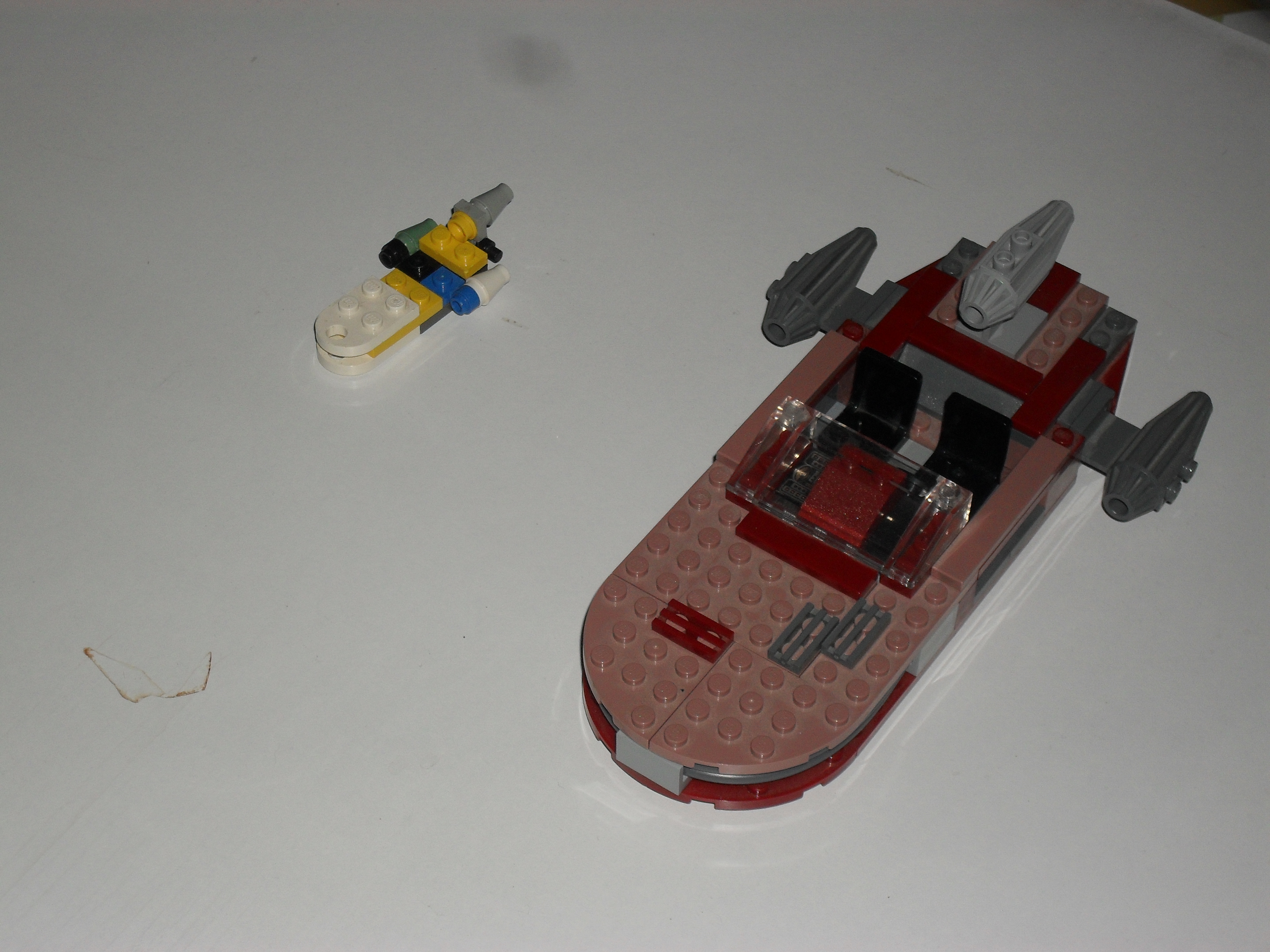 two_versions_of_luke_s_landspeeder.jpg