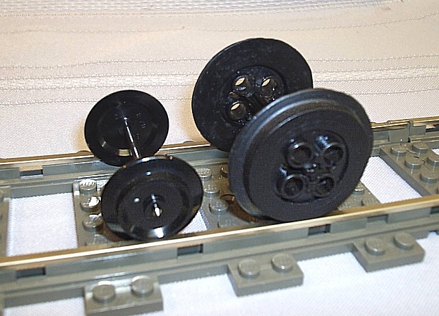 large_train_wheels_next_to_standard_lego_wheel.jpg