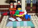 77_mamasan_seated_at_kotatsu.jpg