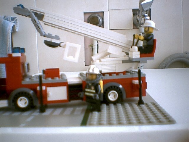 fire_truck_rescue_vehicle_raising_ladder.jpg