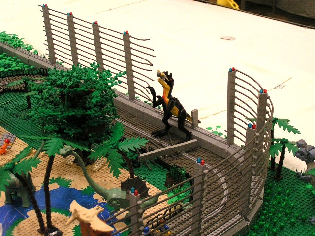 dino_breaking_through_fence.jpg