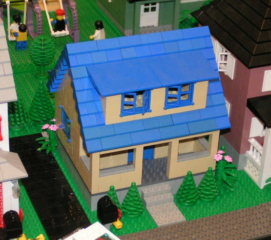 tan_house_blue_roof.jpg