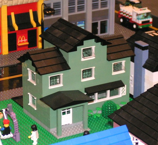 verdigris_house_with_black_roof.jpg