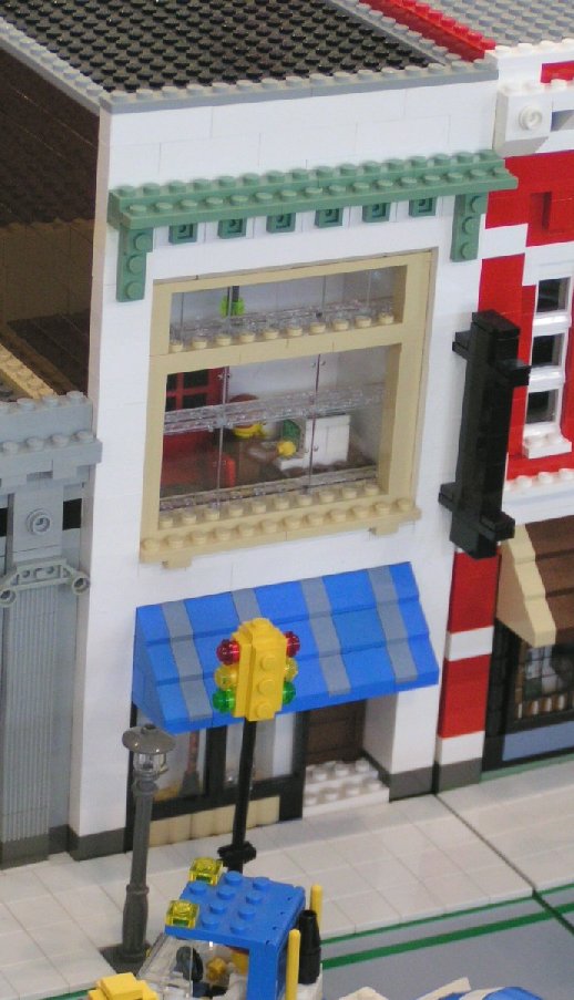whitebuildingwithblueawning.jpg