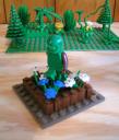 green_guy_walking_in_flowers_by_brian_a.jpg