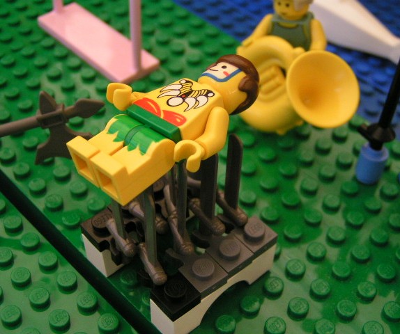 guy_laying_on_swords.jpg