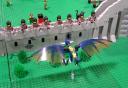wyvern_approaching_archers_on_wall.jpg