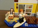 guy_surfing_and_girl_relaxing.jpg
