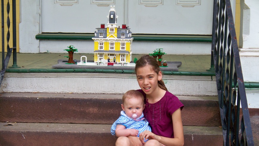 emma_and_sami_on_steps_with_lego_house.jpg