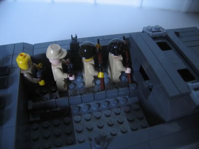 four_marines_on_wip_v3_amtrack_landing_craft.jpg