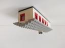 small_grey_bungalow_with_garage_-_side.jpg