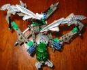 green-mask-nidhiki-body-down-claws-up-aerial-view.jpg