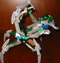 green-mask-nidhiki-body-down-claws-up-side-view.jpg
