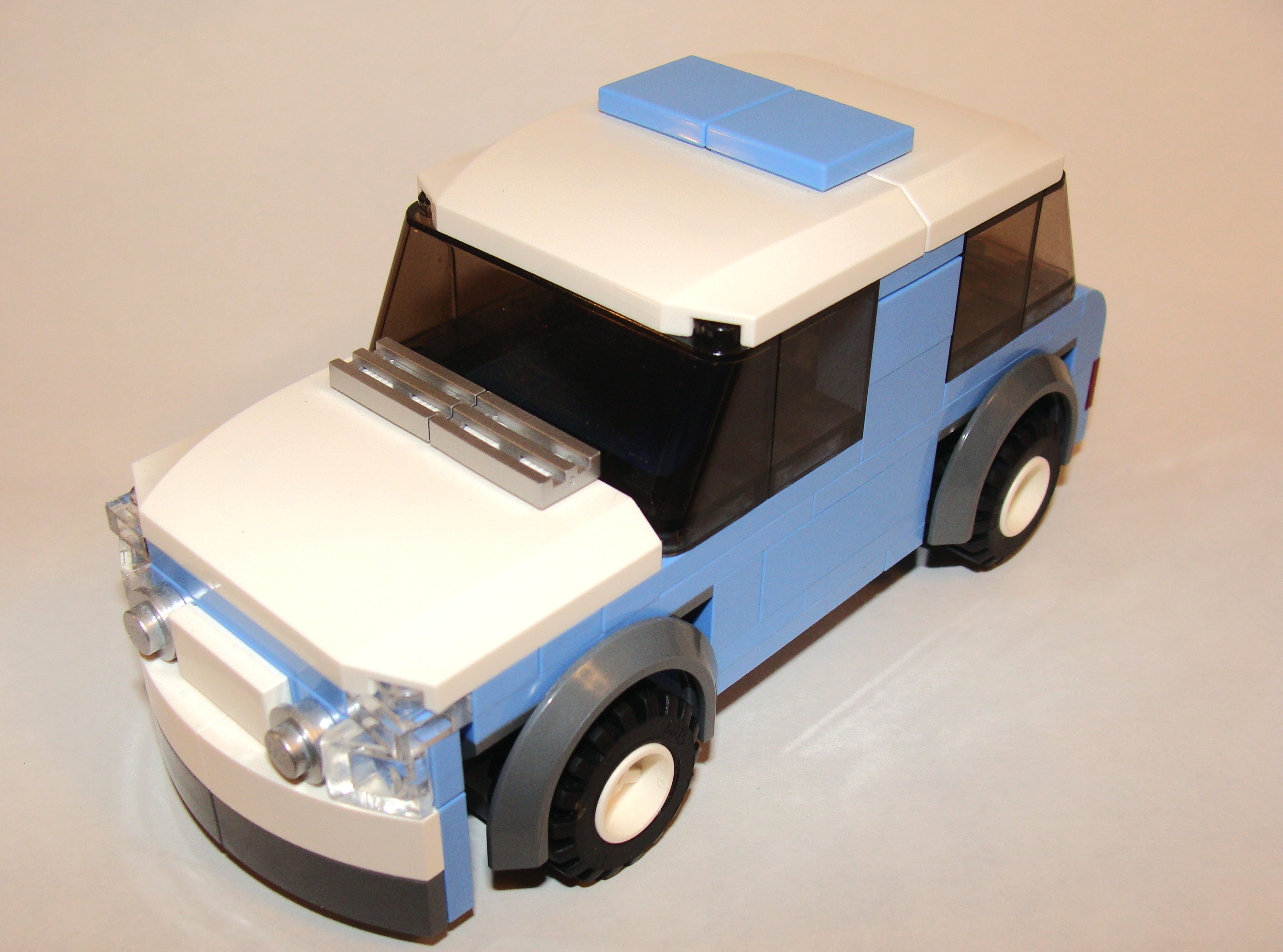 med_blue_car_6_wide_front_angled.jpg