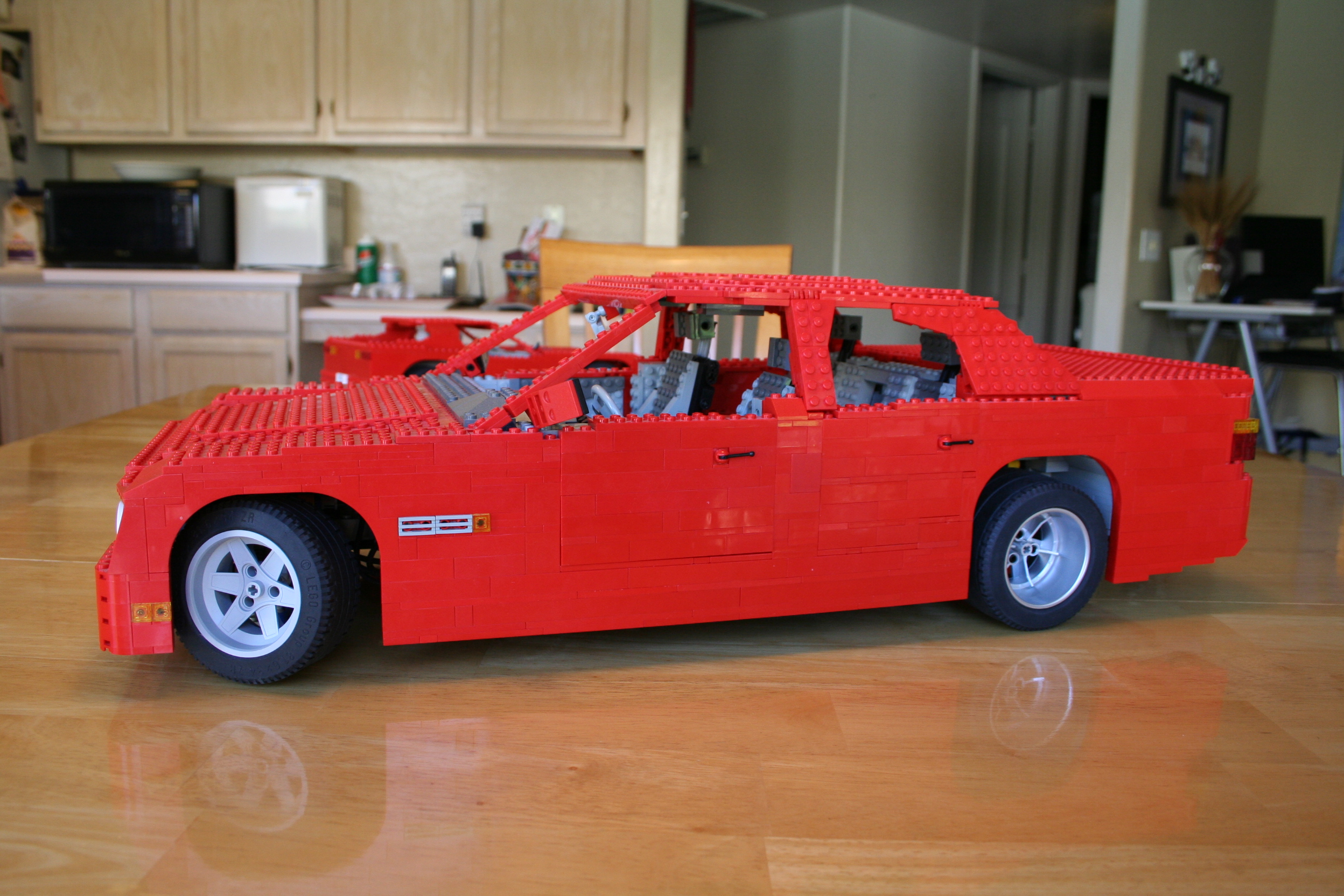 red_sedan_left_ii.jpg