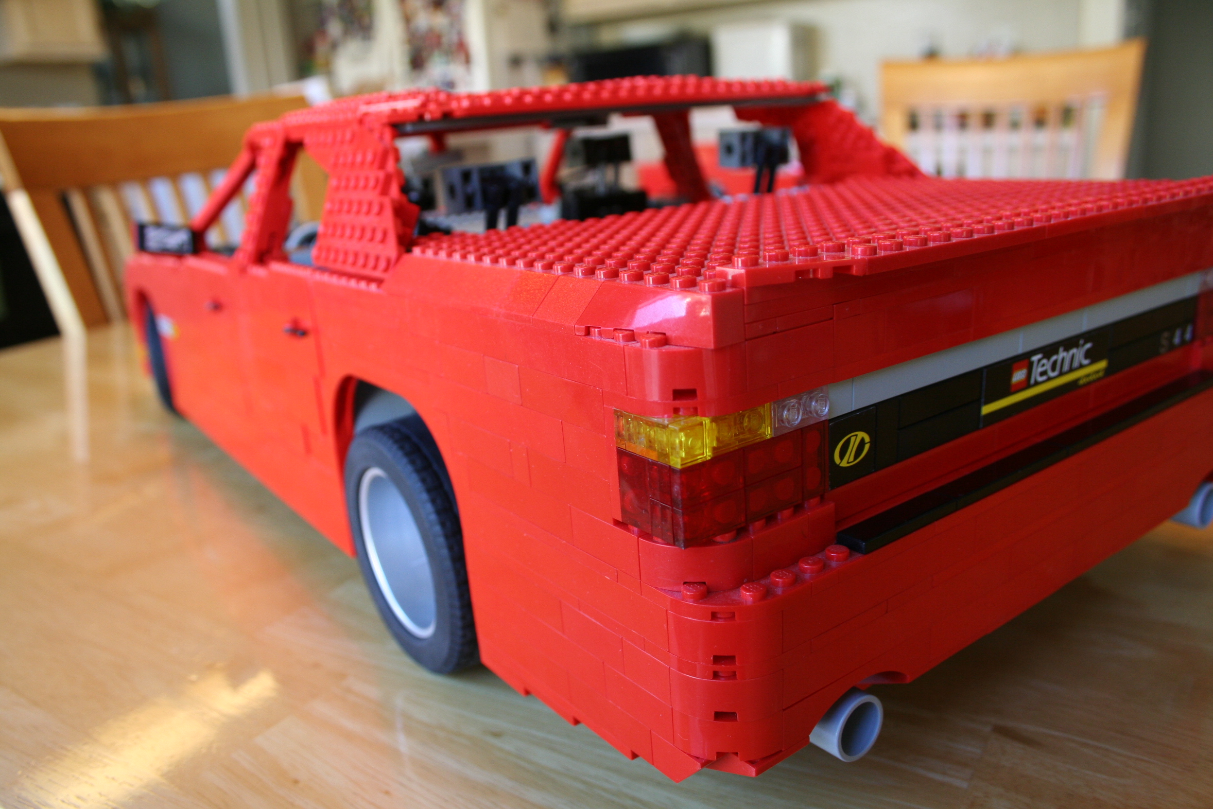 red_sedan_left_rear.jpg