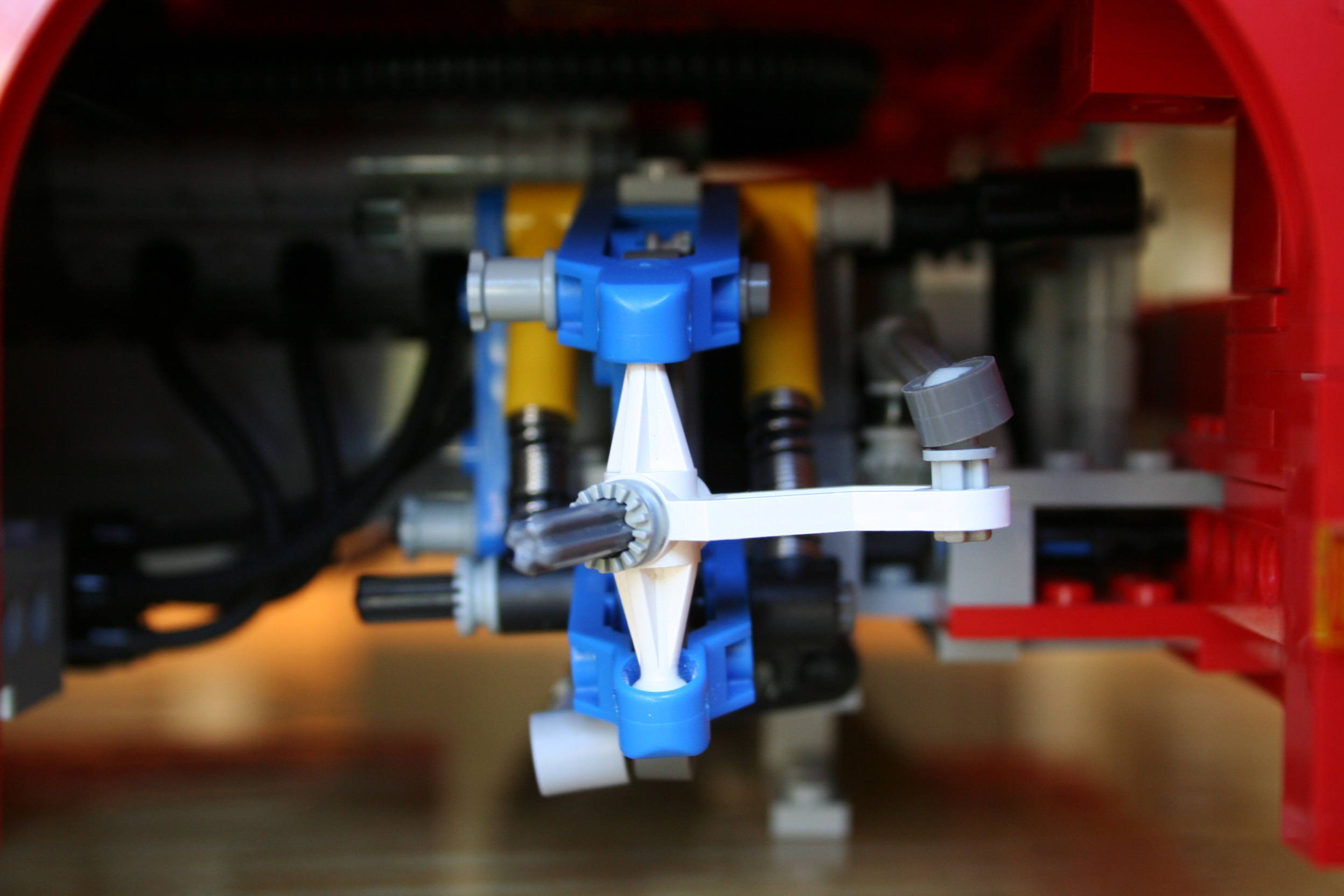 red_sedan_right_front_suspension_ii.jpg