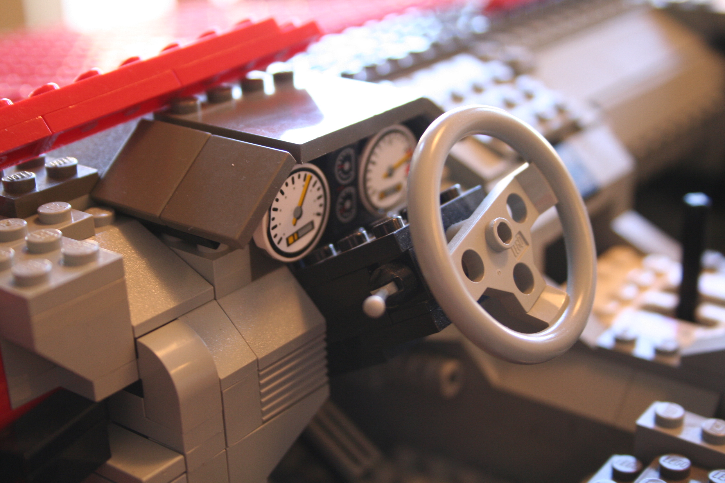 red_sedan_steering_wheel_up.jpg