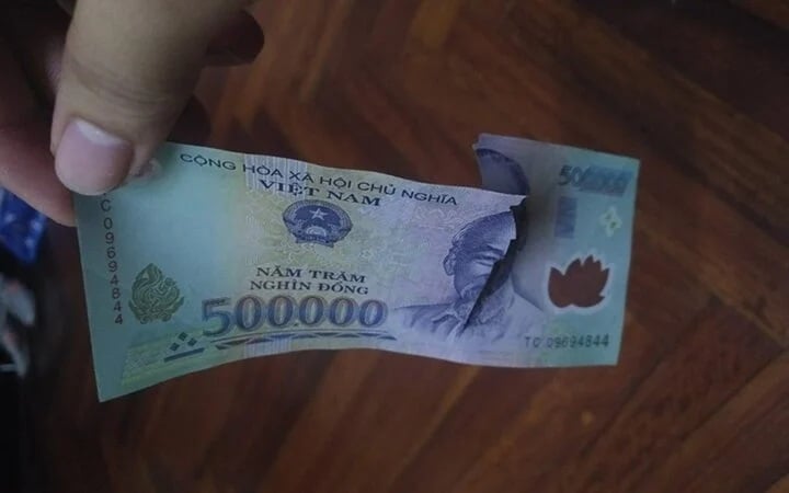 Tiền rách dán lại có dùng được không? Gallery 1