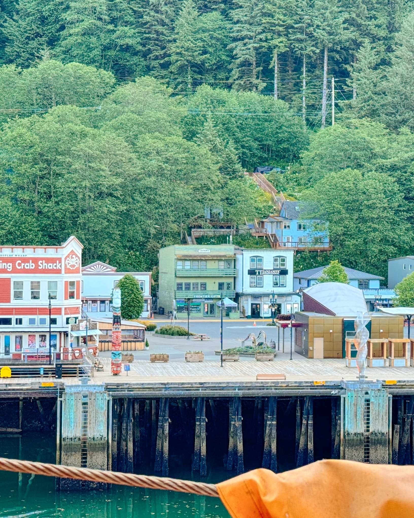 Alaska - Large Bro Colorful Buildings Lush Forest Backdrop Wooden - 08-09-2025 - Vertical.jpg