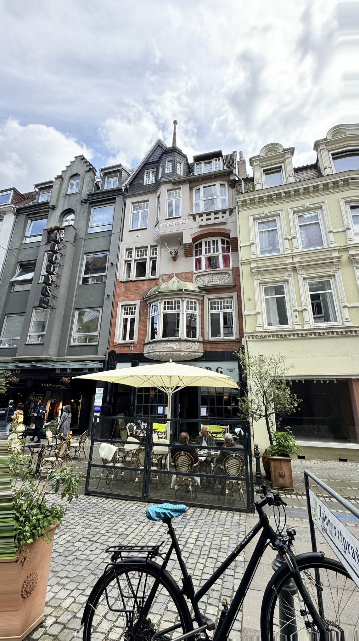 Kiel Germany Cruise Port - Ornate Brick Facade Quaint Patio Seating - 06-05-2024 - Vertical.jpg