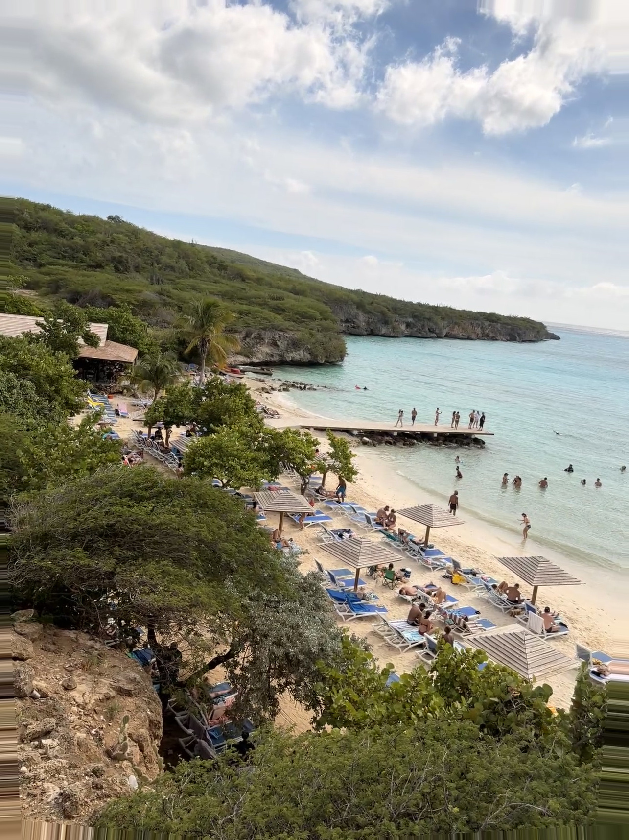 Curacao Cruise Port - Tropical Beach with Beachgoers and Scenic Cliffs - 01-01-2026 - Vertical.jpg