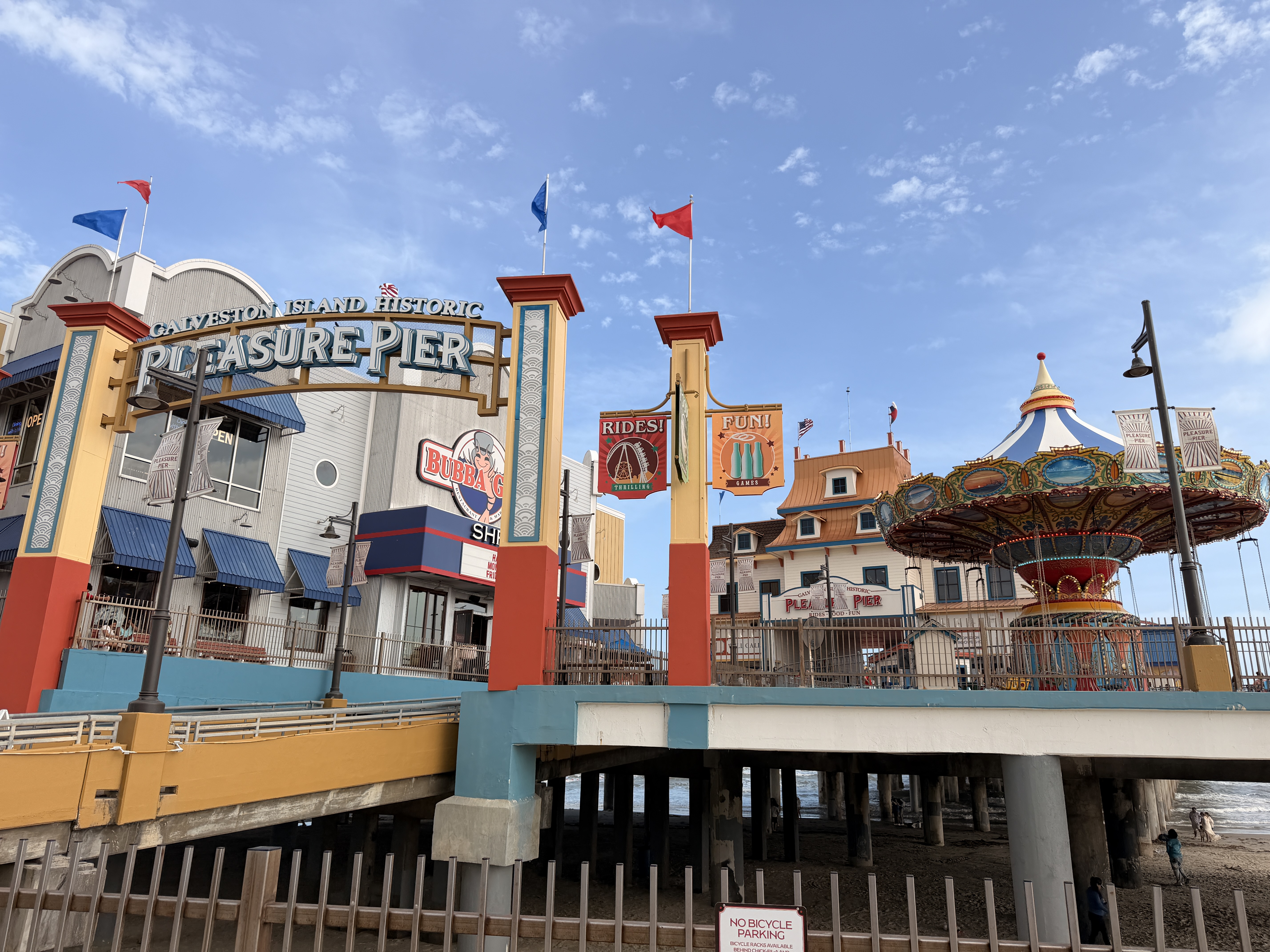 The Galveston Island Historic Pleasure Pier and its Ferris wheel built out over the Gulf