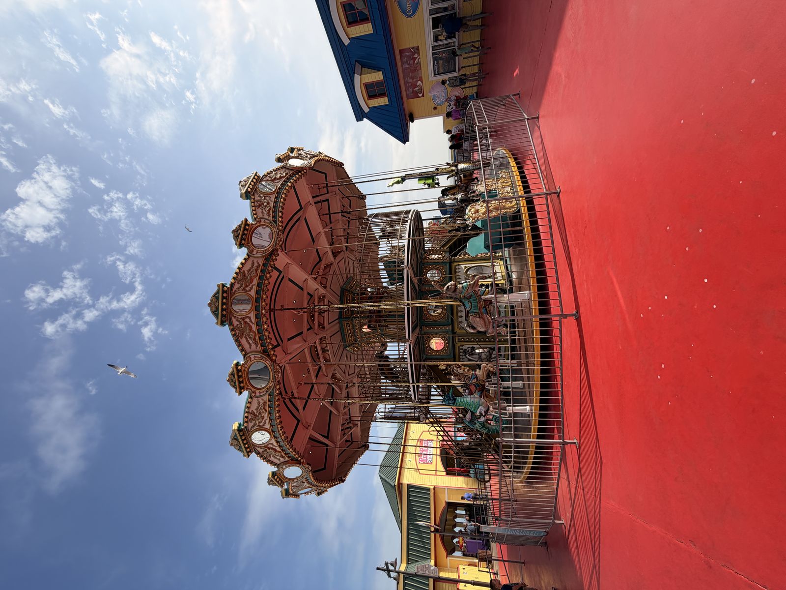 Galveston Cruise Port Pleasure Pier USA MSC Seascape - ornate red-roofed colonial building with MSC Seascape cruise ship docked nearby - 2026-04-03 - Landscape.jpg
