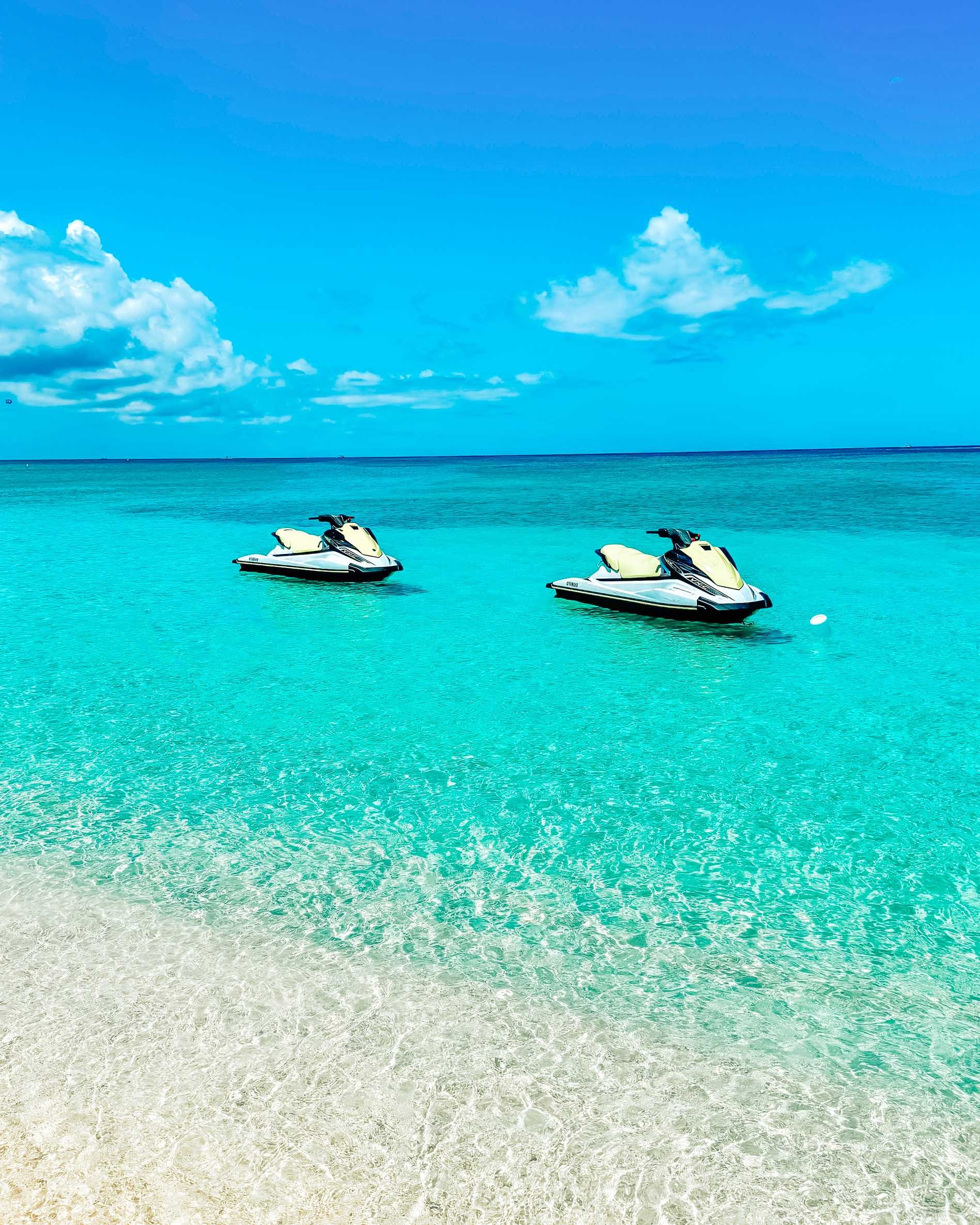 Grand Cayman Cruise Port - Jet Skis at Mile Beach in Georgetown Grand Cayman Social Grand Cayman Professor - Vertical.jpg