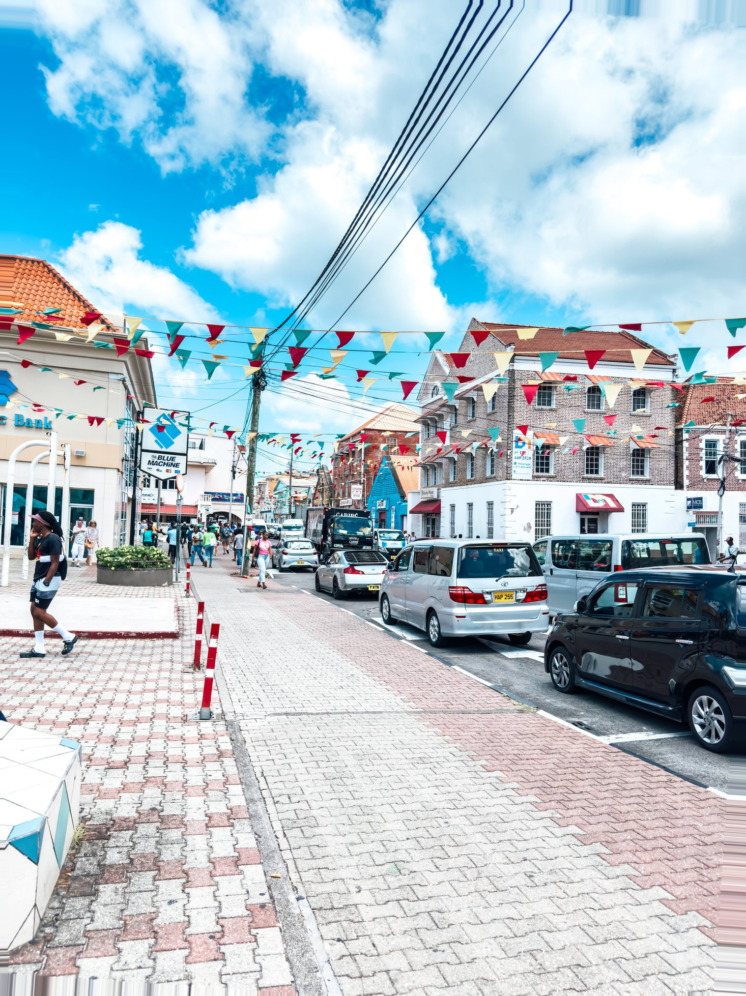 Grenada Cruise Port - Colorful Flag Bunting Vibrant Brick Buildings - 03-13-2024 - Vertical.jpg