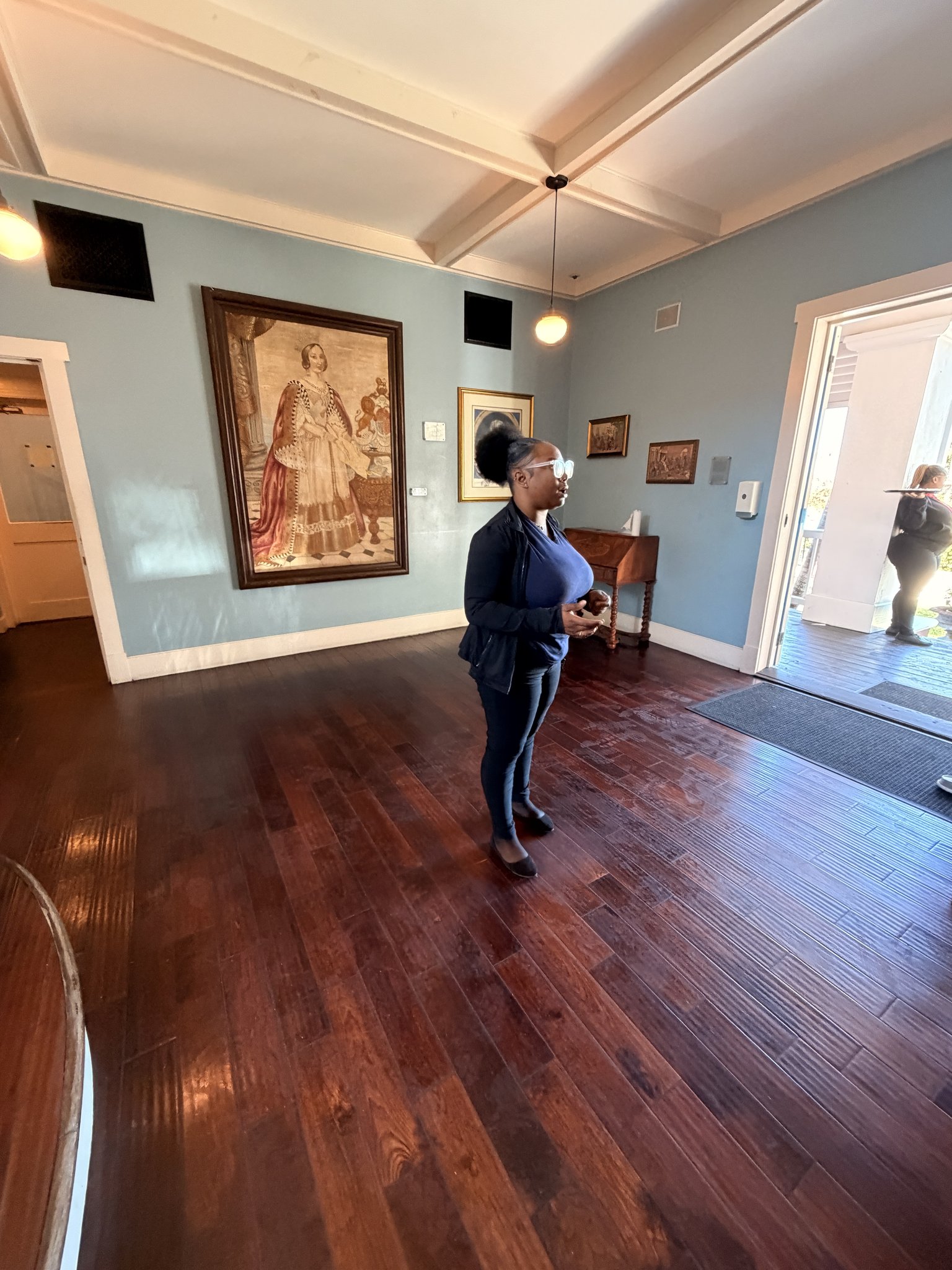 Nassau Cruise Port - A person standing in a room with a wooden floor and - 02-05-2026 - Vertical.jpg