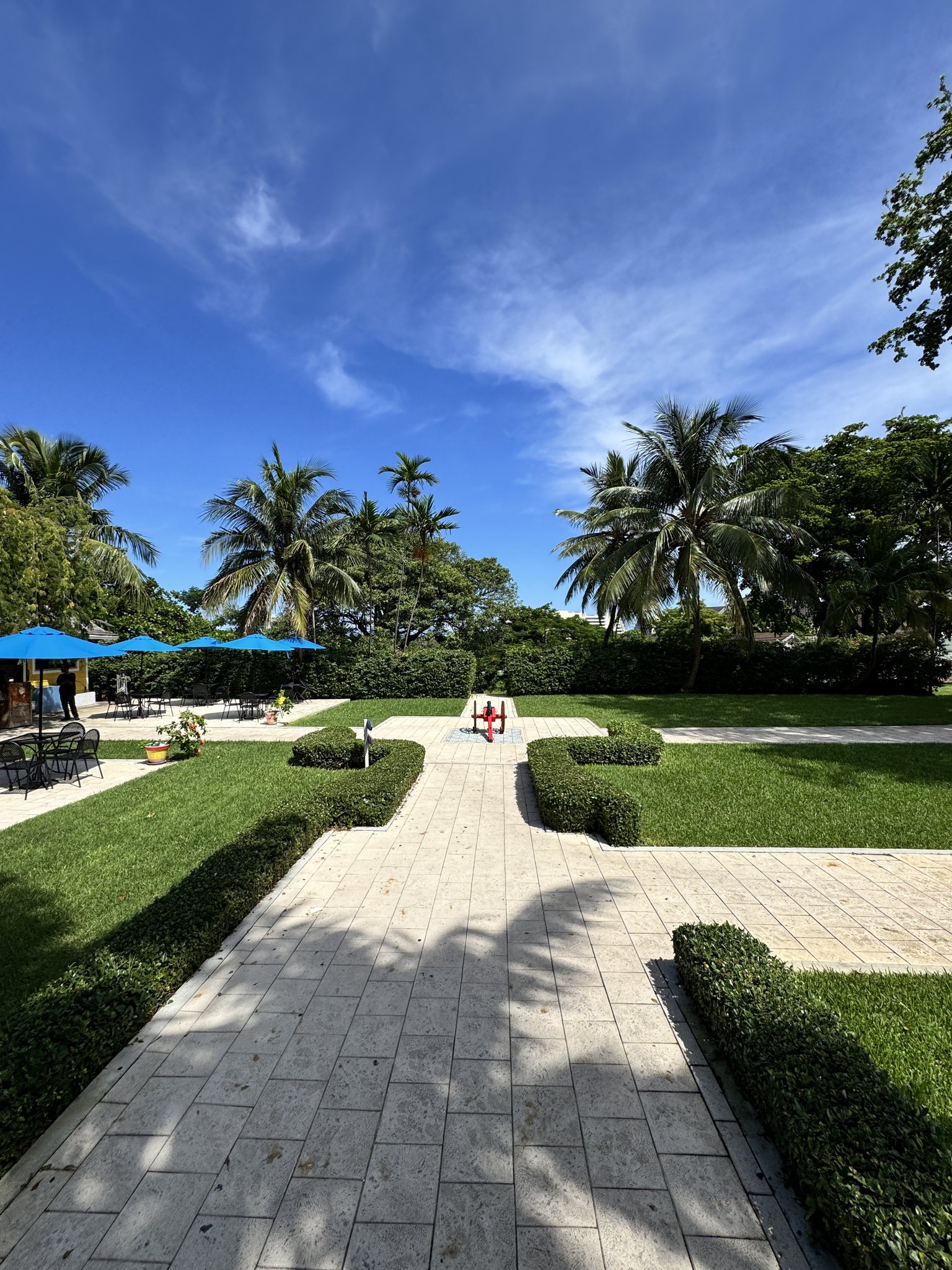 Nassau Cruise Port - Atlantis - A lush, tropical garden with manicured walkways and - 09-20-2025 - Vertical.jpg
