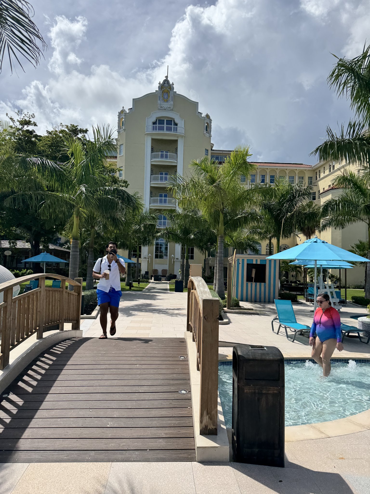 Nassau Cruise Port - Atlantis - A scenic view of a tropical resort with palm trees, a - 09-20-2025 - Vertical.jpg