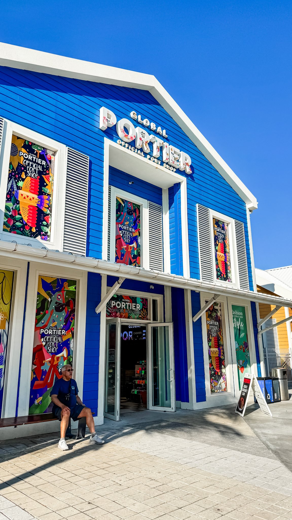 Nassau Cruise Port - Downtown Nassau - Colorful tourist shop with blue exterior and awnings - 03-02-2025 - Vertical.jpg