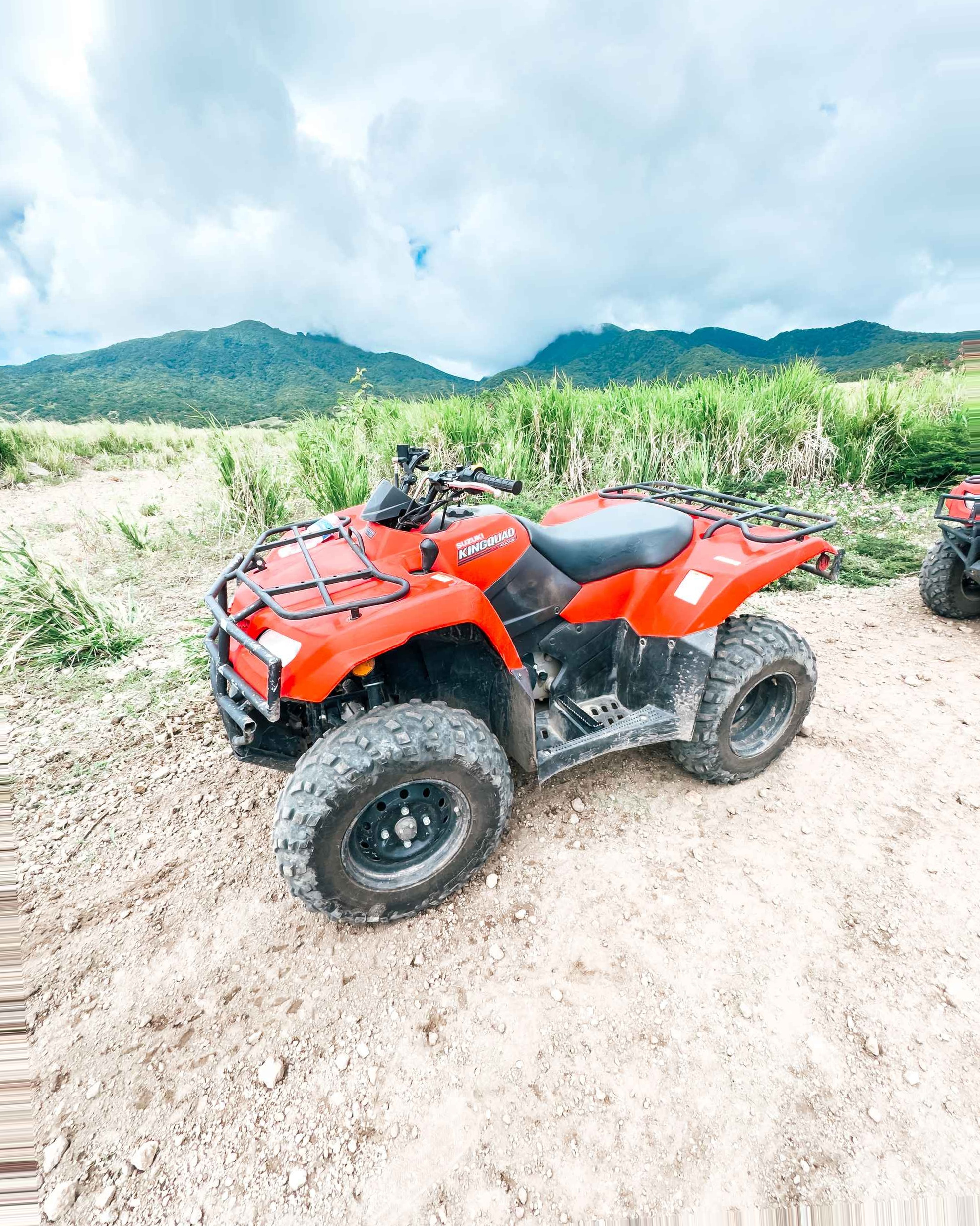 St Kitts Cruise Port - St. Kitts a Couple of Atvs Parked on a Dirt Road - Vertical.jpg