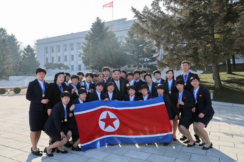 Respected Comrade Kim Jong Un Has Photo Taken with Labour Innovators and Persons of Merit on Occasion of New Year 2025 - Image 2
