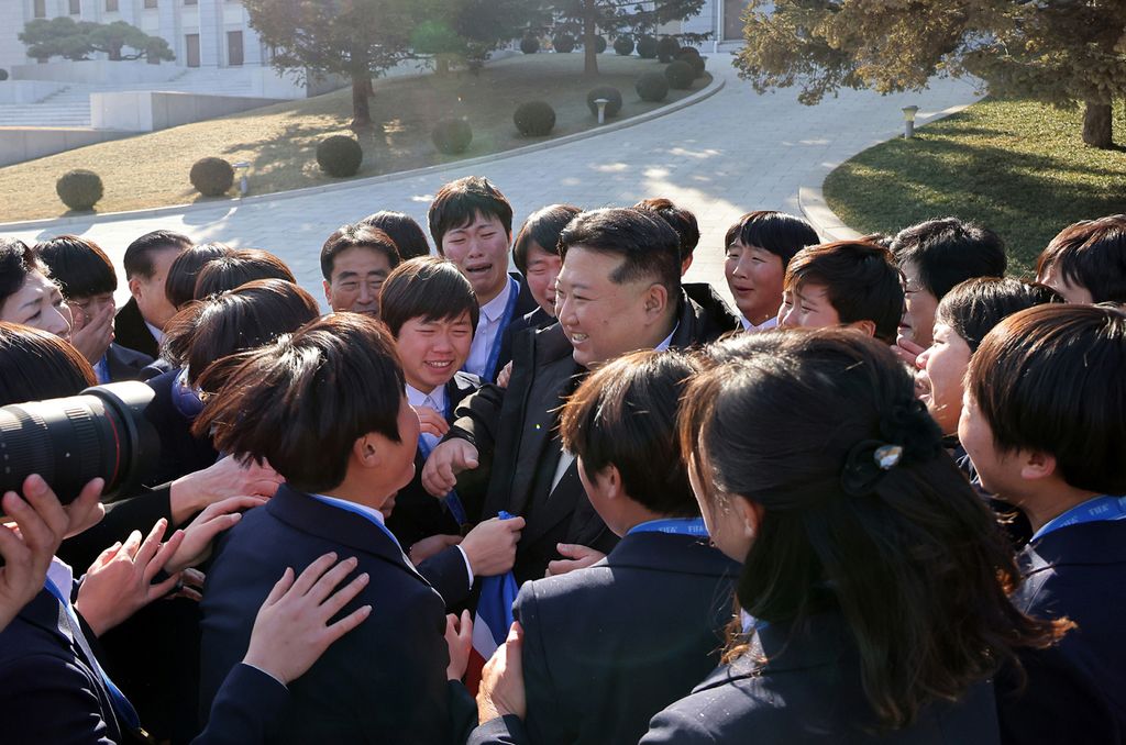 Respected Comrade Kim Jong Un Has Photo Taken with Labour Innovators and Persons of Merit on Occasion of New Year 2025 - Image 5