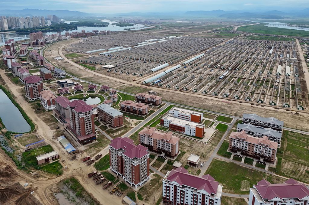 Respected Comrade Kim Jong Un Gives Field Guidance at Construction Sites of Wihwado Combined Greenhouse Farm and Permanent Embankments in Island Area - Image 3