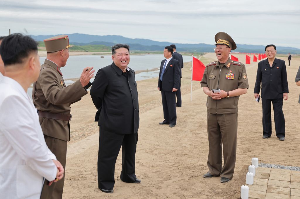Respected Comrade Kim Jong Un Gives Field Guidance at Construction Sites of Wihwado Combined Greenhouse Farm and Permanent Embankments in Island Area - Image 10
