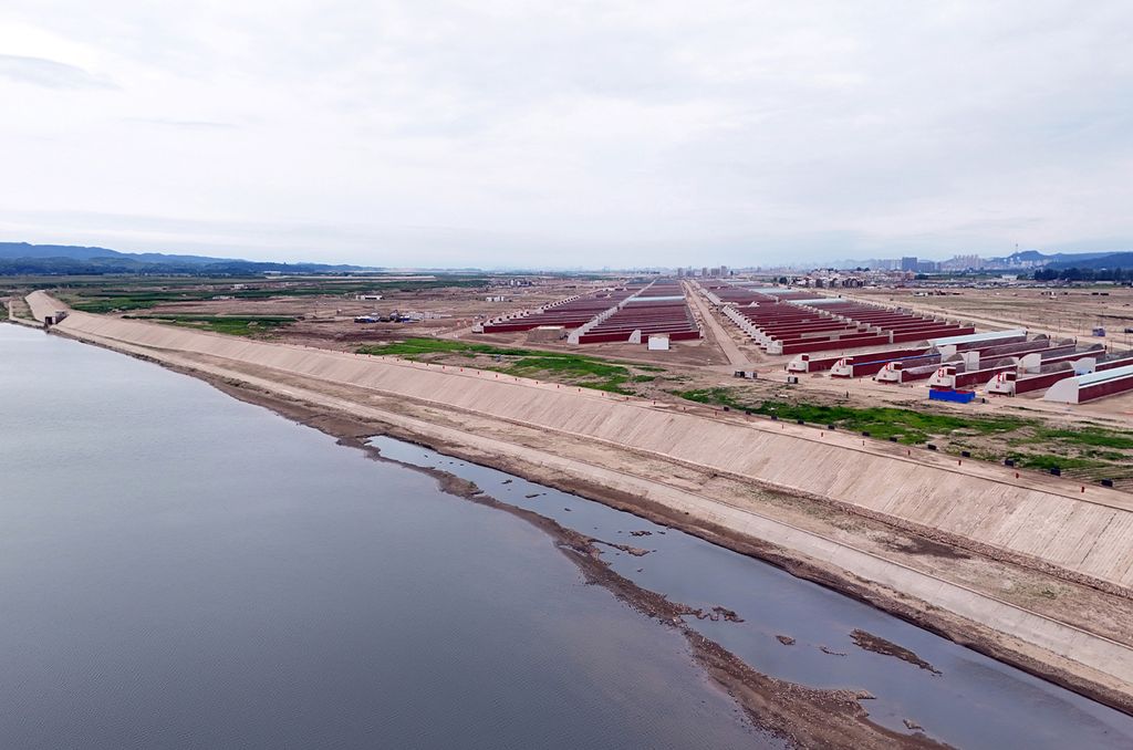 Respected Comrade Kim Jong Un Gives Field Guidance at Construction Sites of Wihwado Combined Greenhouse Farm and Permanent Embankments in Island Area - Image 11