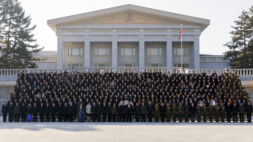 Respected Comrade Kim Jong Un Has Photo Taken with Labour Innovators and Persons of Merit on Occasion of New Year 2025 - Image 4