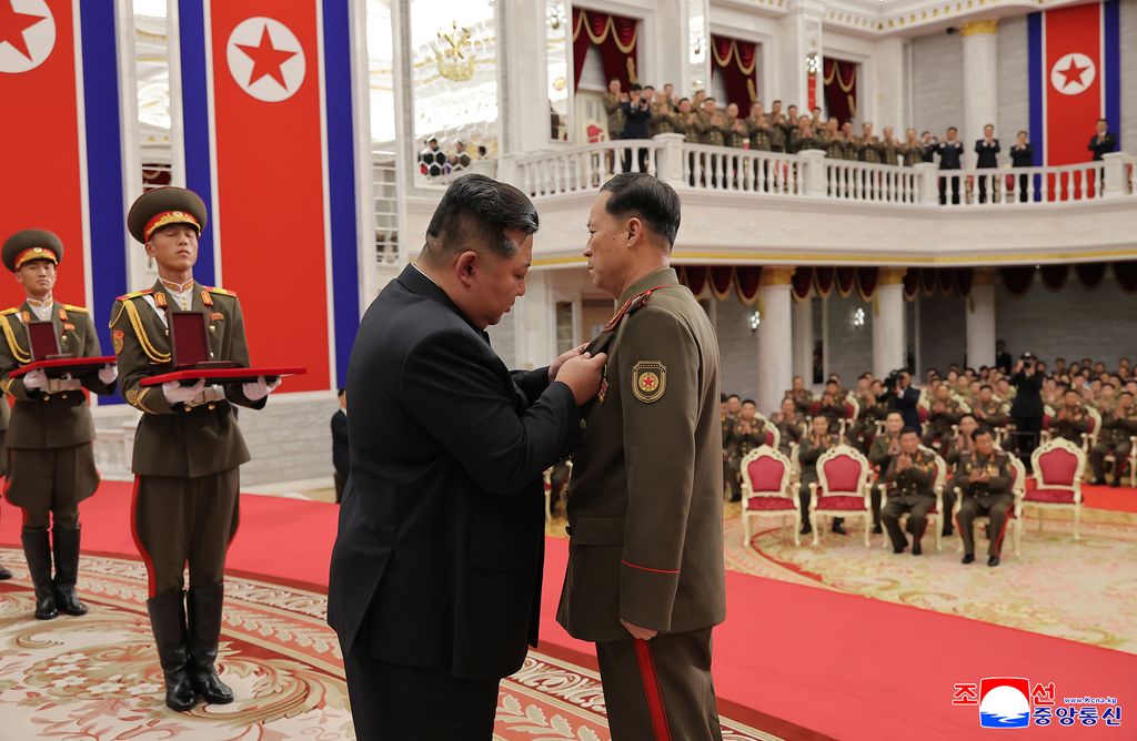 Highest glory to representatives of great honour of DPRK, admirable sonsCeremony of awarding state commendations to commanding officers and combatants of KPA overseas operation units takes place - Image 9