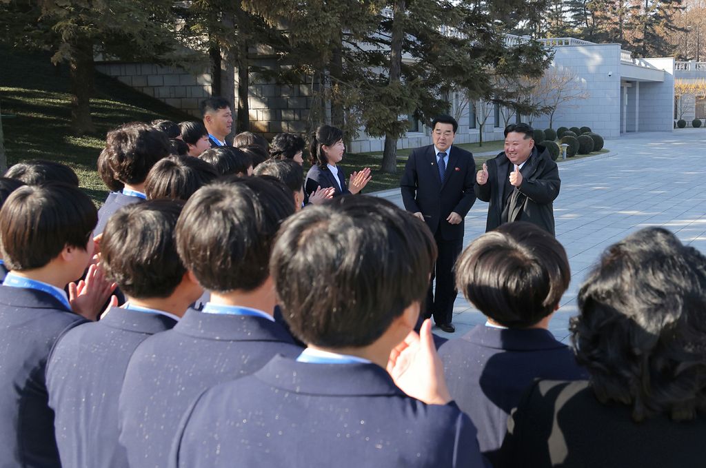 Respected Comrade Kim Jong Un Has Photo Taken with Labour Innovators and Persons of Merit on Occasion of New Year 2025 - Image 3