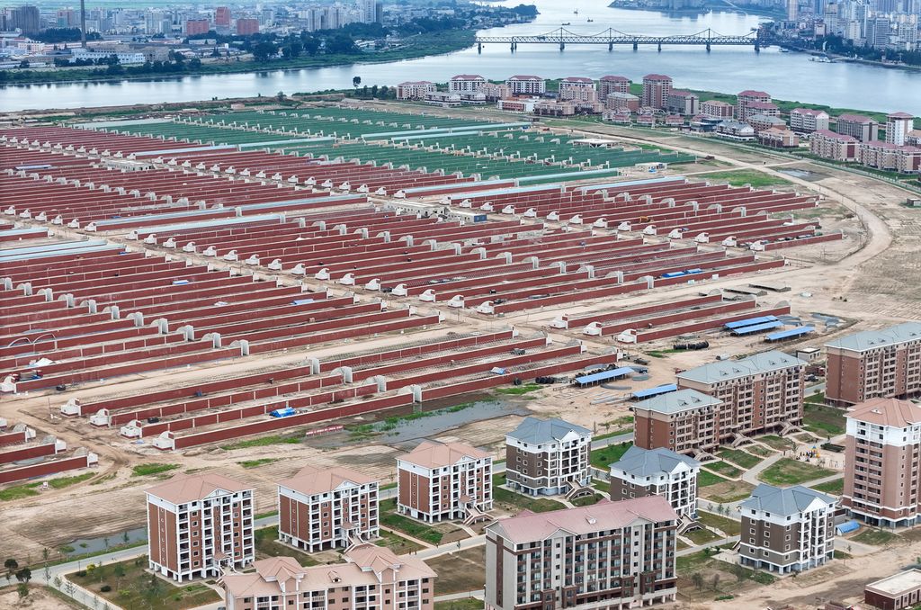 Respected Comrade Kim Jong Un Gives Field Guidance at Construction Sites of Wihwado Combined Greenhouse Farm and Permanent Embankments in Island Area - Image 8