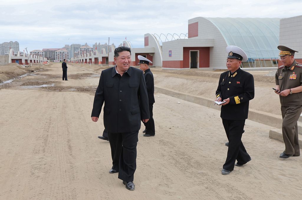 Respected Comrade Kim Jong Un Gives Field Guidance at Construction Sites of Wihwado Combined Greenhouse Farm and Permanent Embankments in Island Area