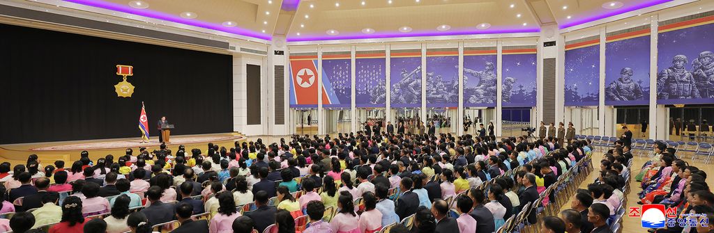 RespectedComrade Kim Jong Un meets bereaved families of martyrs who performed distinguished feats in overseas military operations and has photo session with them - Image 14