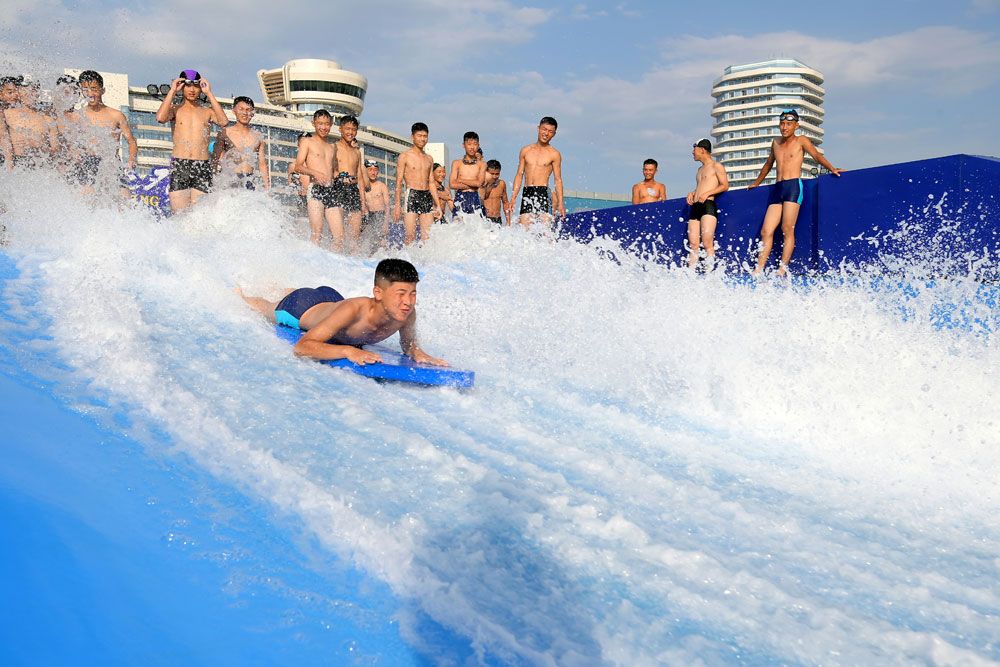 Students of Revolutionary Schools Spend Enjoyable Days in Wonsan Kalma Coastal Tourist Area - Image 26