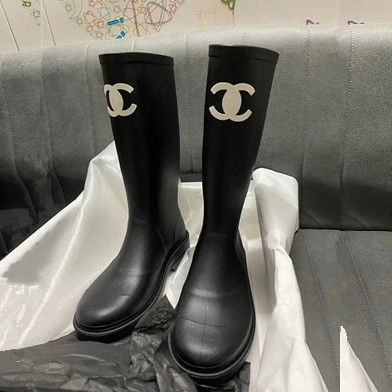 Chanel's iconic CC logo rubber rain boots.